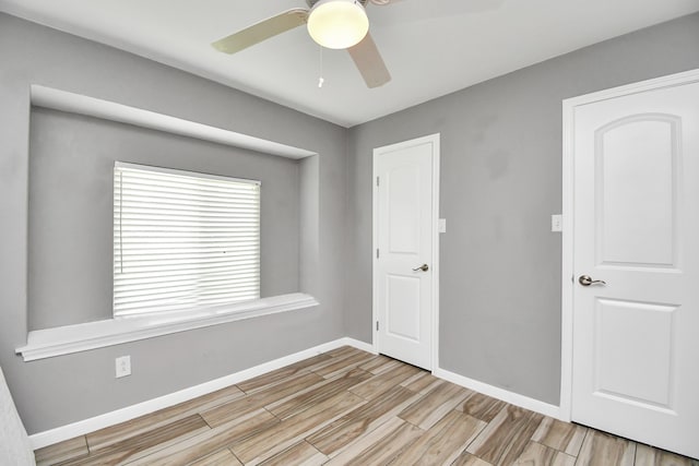 unfurnished room with ceiling fan