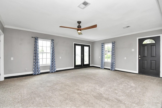 interior space with ceiling fan, carpet flooring, crown molding, and french doors