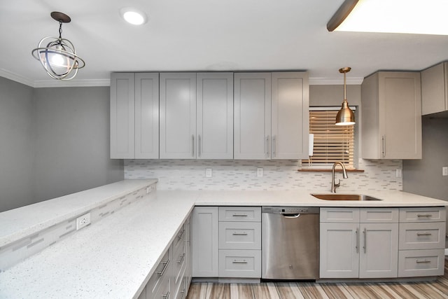 kitchen featuring sink, gray cabinets, stainless steel dishwasher, and hanging light fixtures