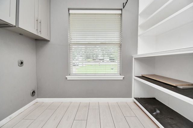 washroom featuring cabinets and hookup for an electric dryer