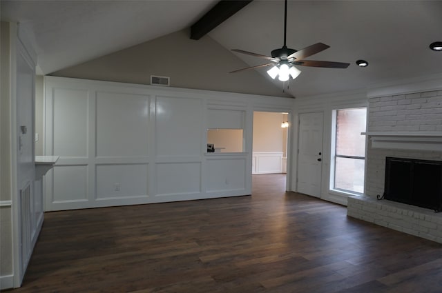 unfurnished living room featuring vaulted ceiling with beams, ceiling fan, dark hardwood / wood-style floors, and a brick fireplace