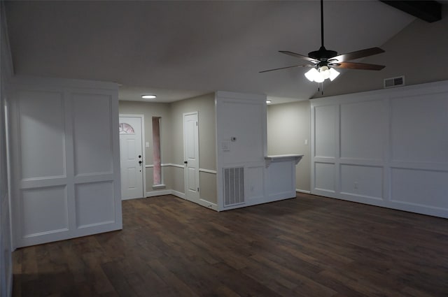 unfurnished room featuring lofted ceiling with beams, ceiling fan, and dark wood-type flooring