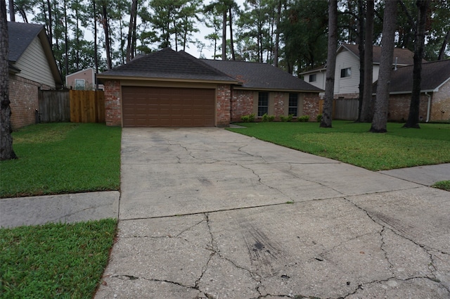 view of front of home with a garage and a front yard