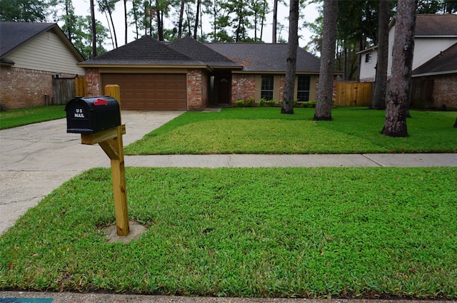 single story home featuring a front yard and a garage