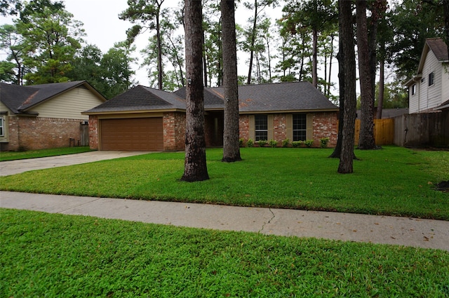 ranch-style house with a garage and a front lawn