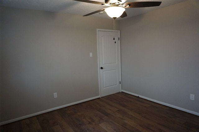 unfurnished room featuring dark hardwood / wood-style floors and ceiling fan