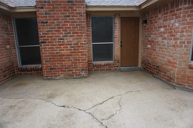 doorway to property featuring a patio