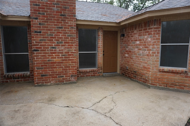 doorway to property featuring a patio