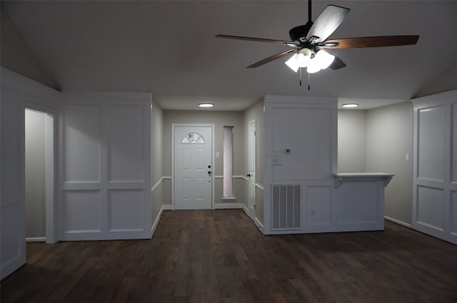 foyer featuring ceiling fan, dark hardwood / wood-style flooring, and lofted ceiling