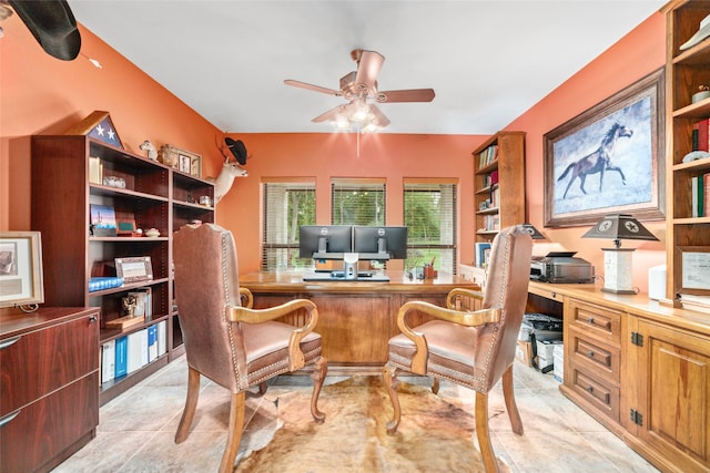 tiled office with ceiling fan and built in desk