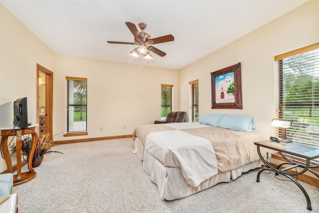 bedroom with light colored carpet and ceiling fan