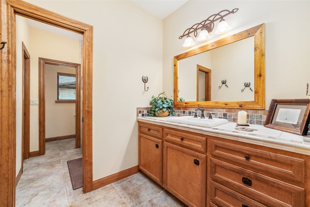 bathroom featuring vanity and decorative backsplash