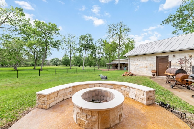 view of patio / terrace with an outdoor fire pit