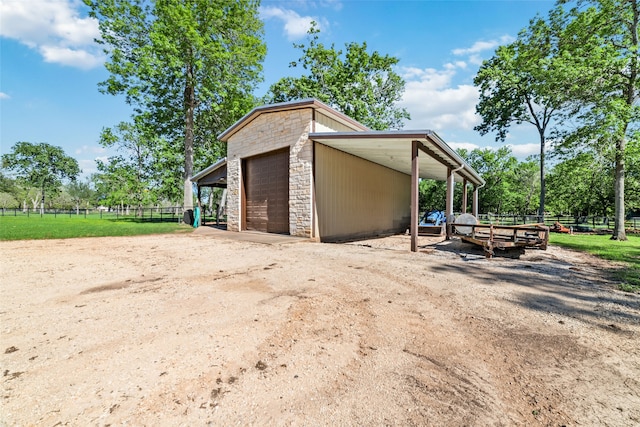 exterior space featuring an outbuilding