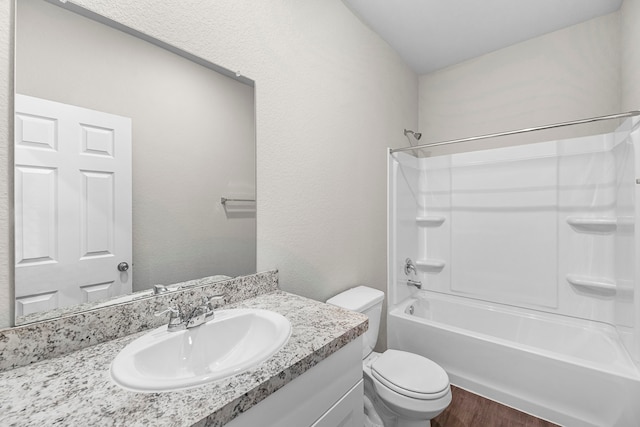 full bathroom featuring vanity, toilet, shower / bath combination, and wood-type flooring