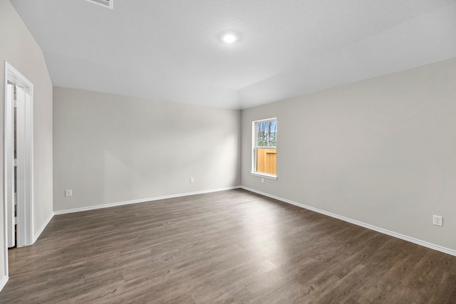 unfurnished room with dark hardwood / wood-style floors