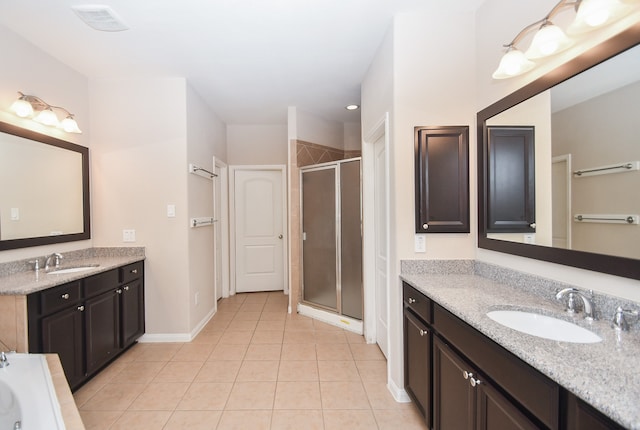 bathroom with vanity, tile patterned floors, and walk in shower