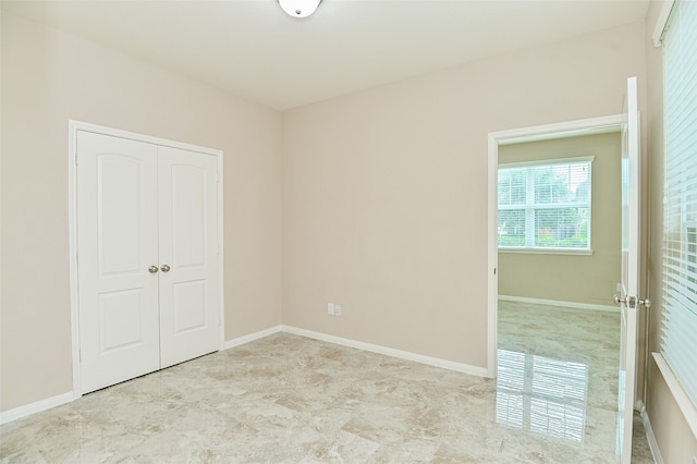 unfurnished bedroom featuring a closet