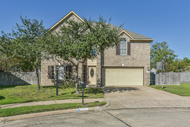 view of front of house featuring a front yard and a garage