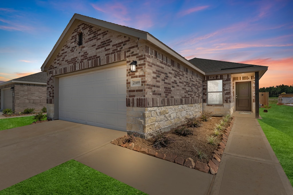 view of front of home with a garage