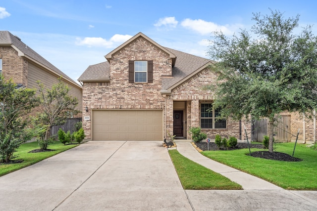 view of front of house featuring a front lawn and a garage