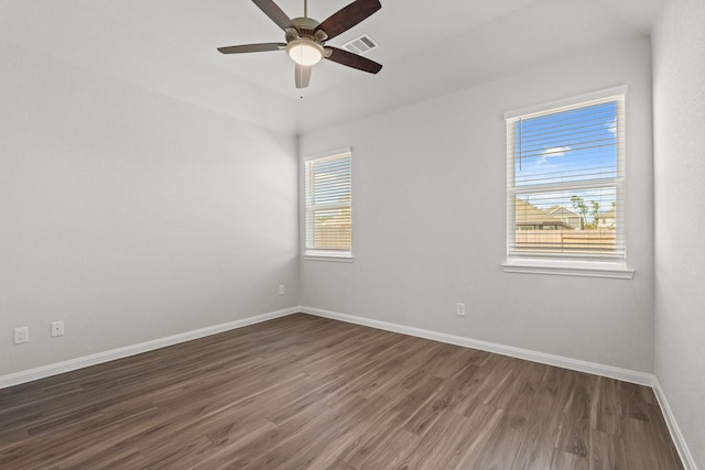 empty room featuring dark hardwood / wood-style floors and ceiling fan