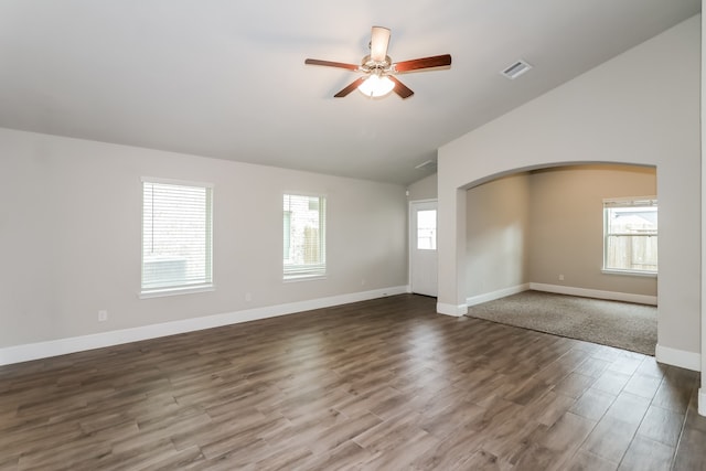 unfurnished room featuring hardwood / wood-style floors, vaulted ceiling, and ceiling fan