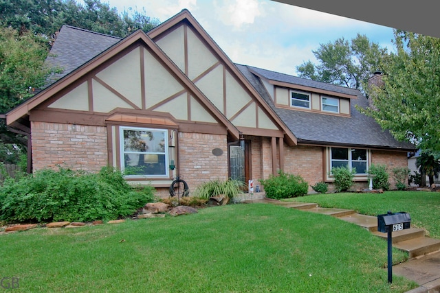 tudor house featuring a front yard