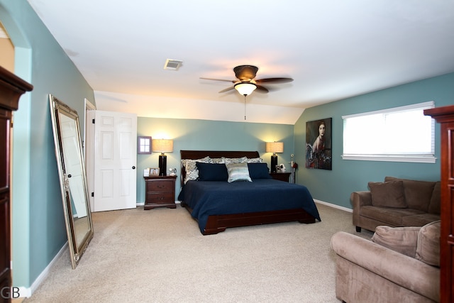 bedroom with ceiling fan, light carpet, and lofted ceiling