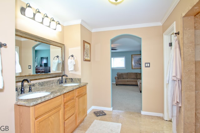 bathroom with vanity and ornamental molding