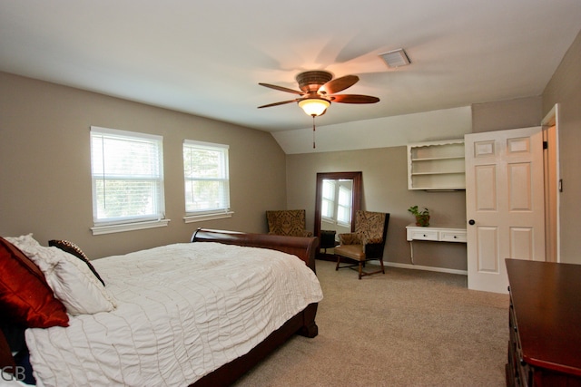 bedroom with carpet, ceiling fan, and vaulted ceiling