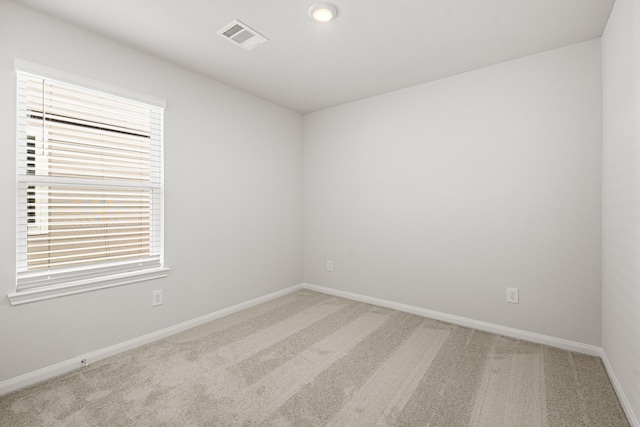 empty room featuring carpet flooring