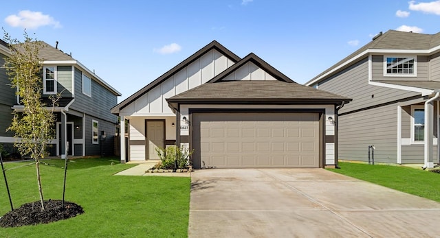 view of front of home with a garage and a front yard