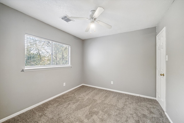 unfurnished room featuring carpet and ceiling fan