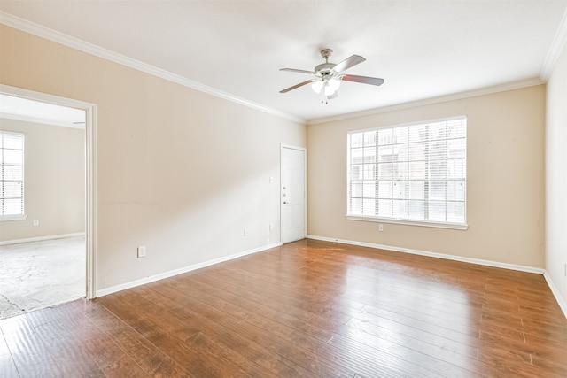 unfurnished room featuring ceiling fan, wood-type flooring, and ornamental molding