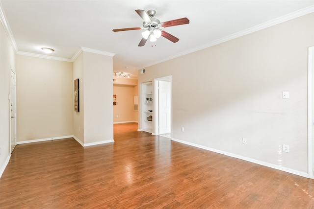 unfurnished room with ceiling fan, wood-type flooring, and crown molding