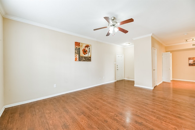 spare room with hardwood / wood-style flooring, ceiling fan, and ornamental molding