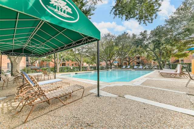 view of swimming pool featuring a patio area