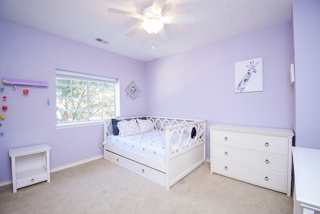 carpeted bedroom featuring ceiling fan