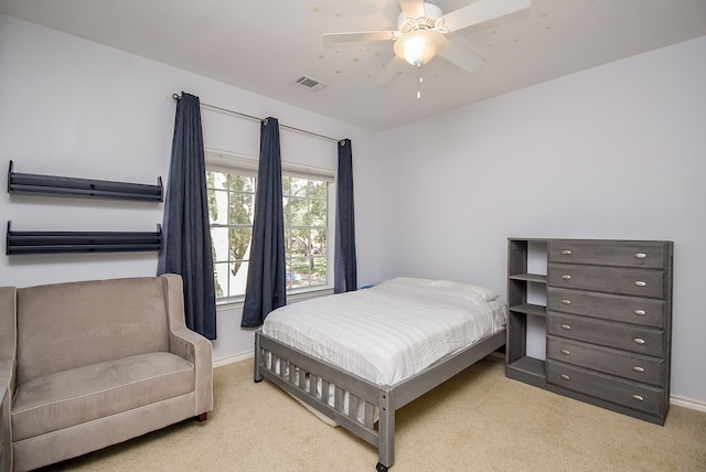 carpeted bedroom with ceiling fan