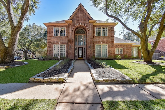 view of front of home with a front lawn