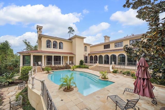 view of pool featuring a patio