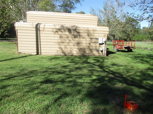 view of outdoor structure featuring a yard