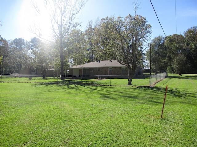 view of yard with a rural view