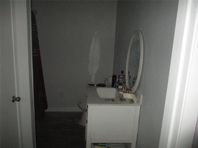 bathroom featuring vanity and toilet