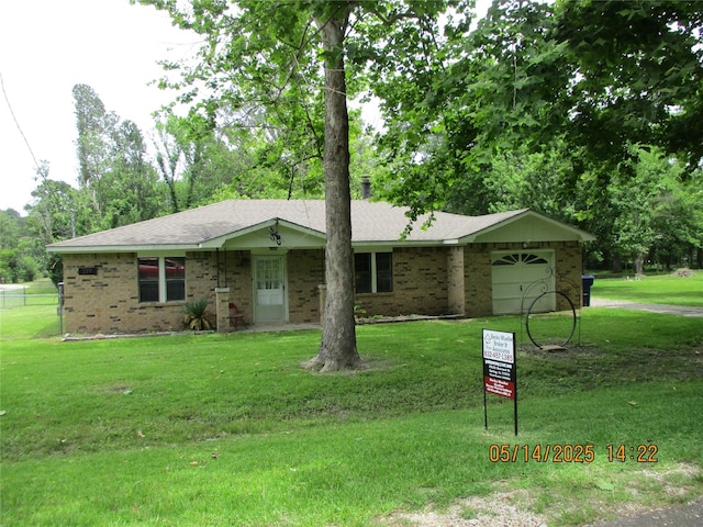 319 River Rd, Goodrich, TX 77335 - ranch-style home with an attached garage, brick siding, roof with shingles, and driveway
