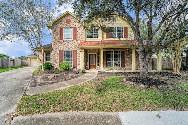 view of front of property featuring a porch and a garage