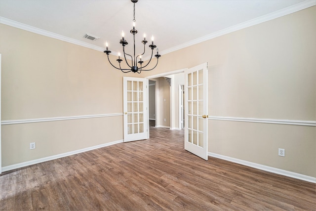 unfurnished dining area featuring french doors, crown molding, and wood-type flooring