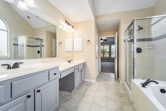 bathroom featuring tile patterned floors, vanity, lofted ceiling, and shower with separate bathtub