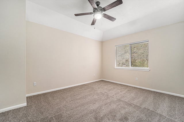 unfurnished room with carpet flooring, ceiling fan, and vaulted ceiling